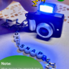 Oh Snap Camera Charm with a picture-capture button